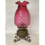 Large oil lamp with cranberry tinted shade