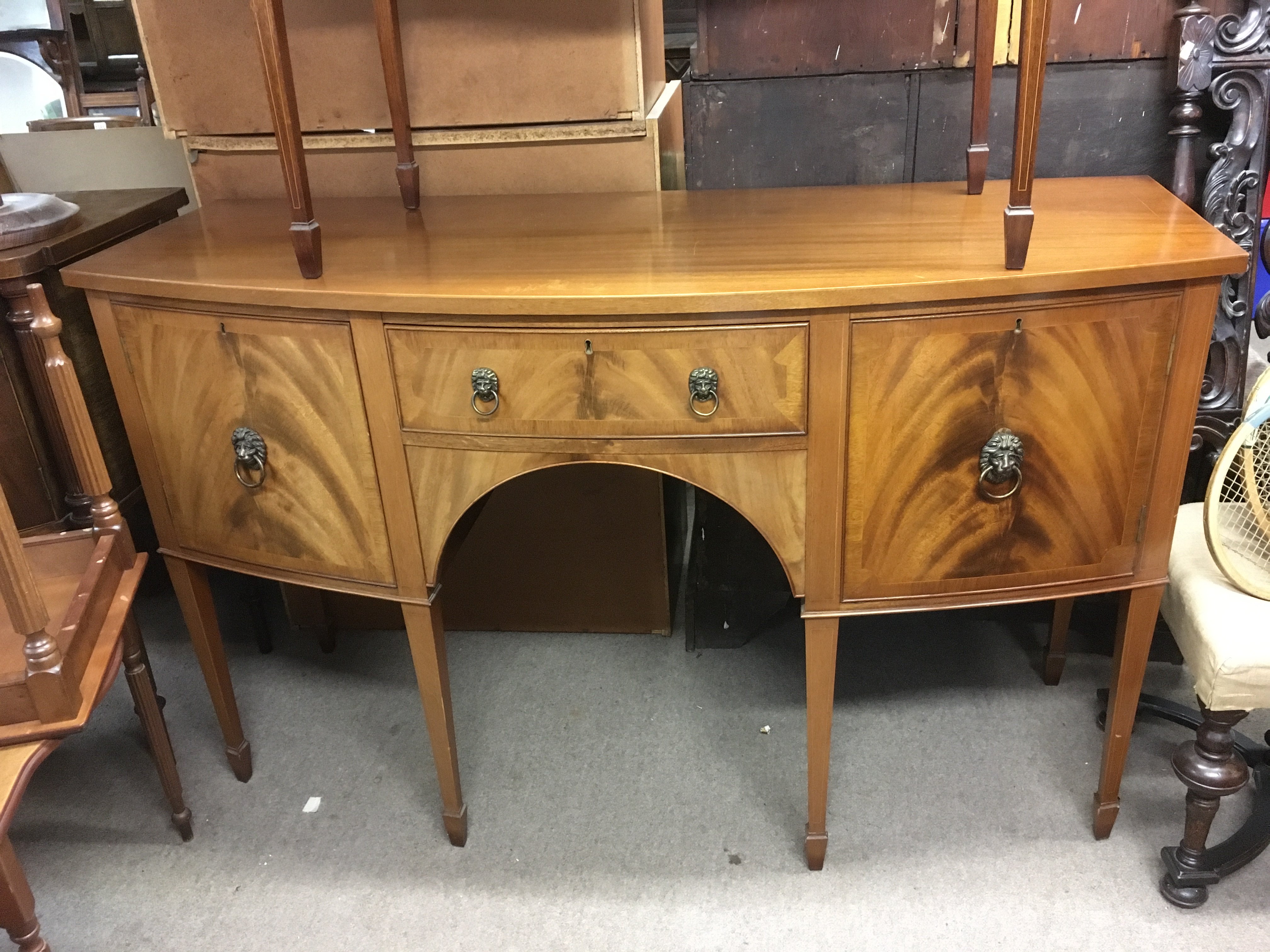 An inlaid mahogany sideboard fitted with two cupbo