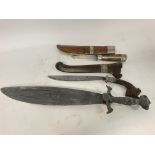 Three odd knives, one possibly African. One blade