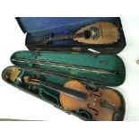 A cased violin and a cased mandolin