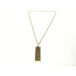 9ct gold ingot on chain. Total weight 37.56g