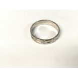 18ct white gold band. Size L and 3.44g.