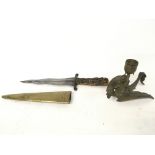 Kris blade dagger, featuring a brass scabbard and