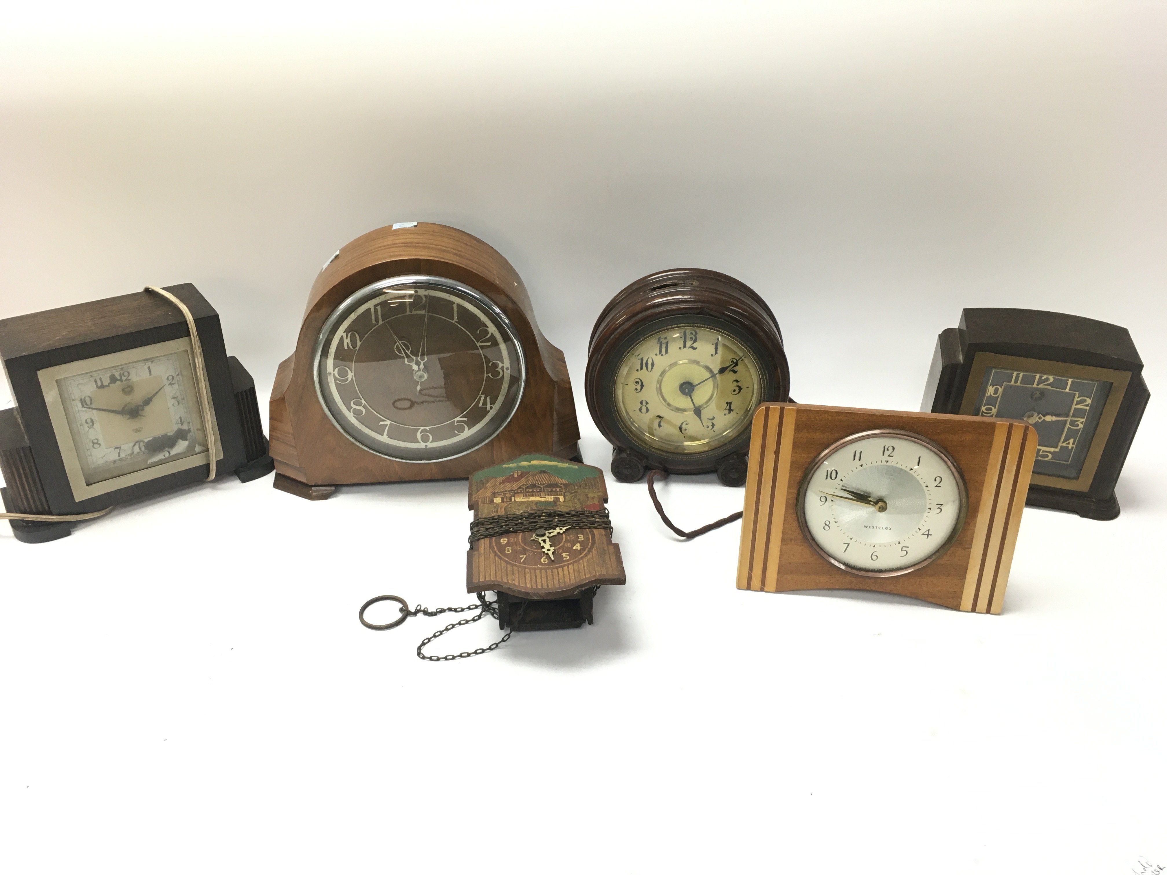 A collection of vintage clocks including an early