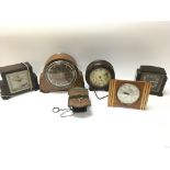 A collection of vintage clocks including an early