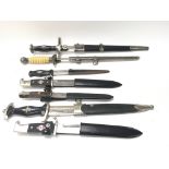 A collection of various German reproduction dagger