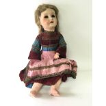 An Early 20th century composition doll with double