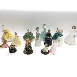 Collection of various figurines including royal Do