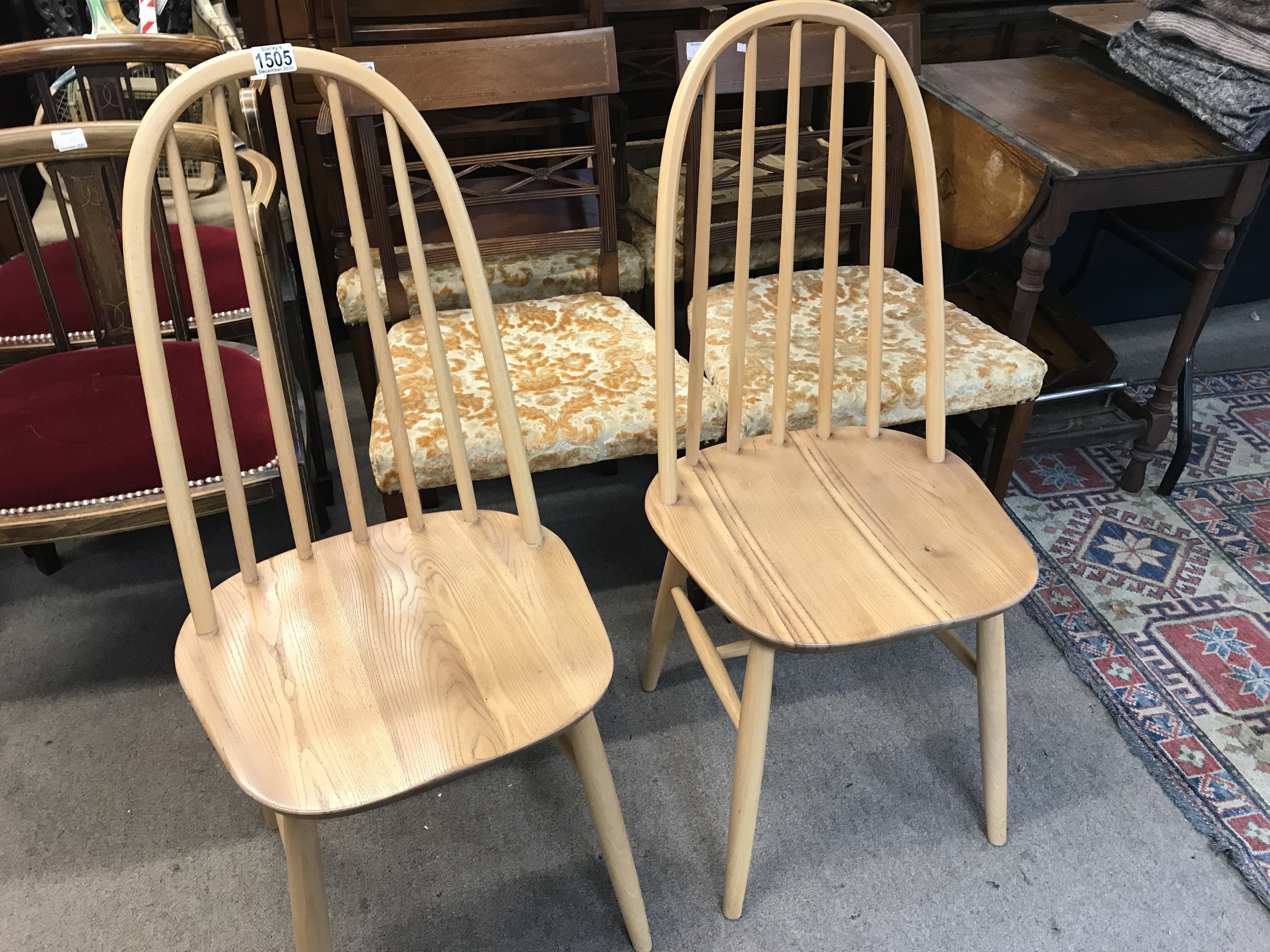 A pair of Ercol dining chairs stick backs above so