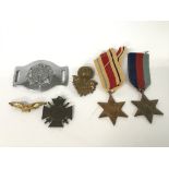 Two World War II medals together with military issue buckles and badges