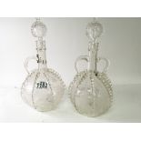 A pair of antique Dutch glass decanters with raise