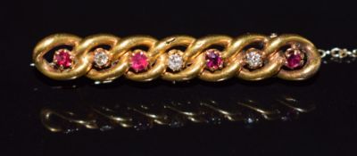 A 15ct gold curb link brooch set with diamonds and rubies, 3.3g, 3.8cm
