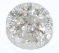 A loose round cut diamond measuring approximately 0.72cts