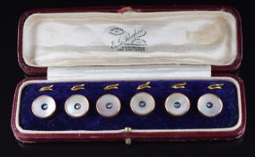 A set of studs set with mother of pearl and a rose cut diamond to the centre, in original E.G.
