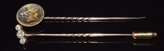 Masonic yellow metal stick pin and a 9ct gold stick pin set with three diamonds, 3.3g