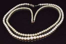 Two single strands of cultured pearls, one with 9ct gold clasp the other with silver clasp
