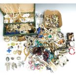 A collection of costume jewellery including vintage brooches, beads, earrings, etc