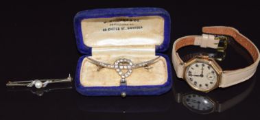 A 9ct gold Skinner watch, 9ct gold brooch set with a pearl and diamonds (1.9g) and a silver brooch