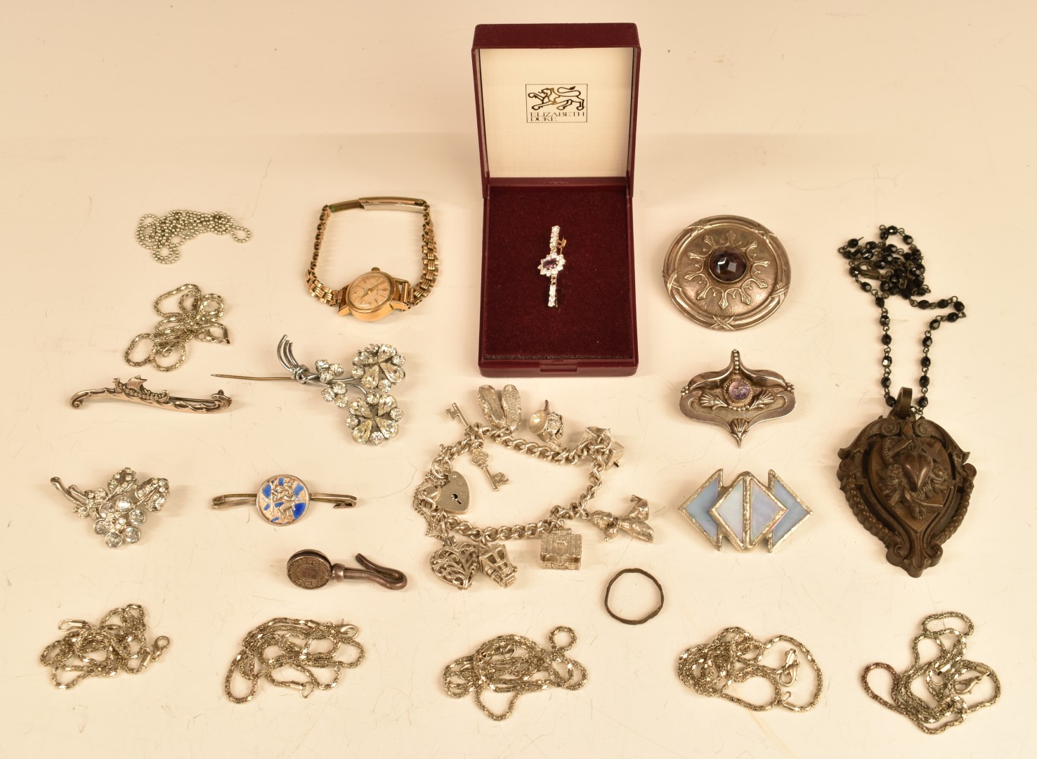 A quantity of costume jewellery including Victorian vulcanite pendant, silver charm bracelet, Celtic