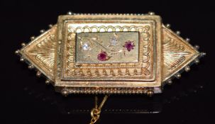 Victorian yellow metal brooch set with rubies and diamonds, with glass compartment verso, 8.5g, 4.
