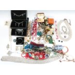 A collection of costume jewellery including crystal beads, necklaces, brooches, etc