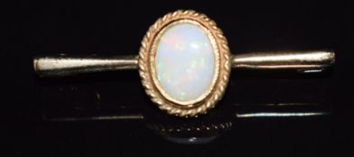 A 9ct gold brooch set with an opal cabochon, 1.9g, 3cm
