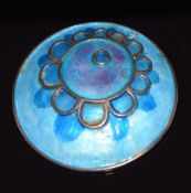 Norman Grant silver pendant/ brooch set with blue/ purple enamel with floral design, 5.5cm diam