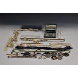 A collection of costume jewellery including Scottish silver brooch, silver brooch set with amber,