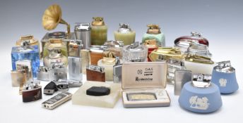 A large collection of gas lighters including Colibri, Wedgwood, Rubicon, Diplomat, advertising,