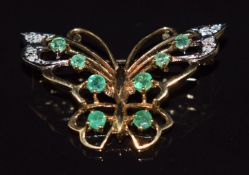 A 9ct gold butterfly brooch set with emeralds and diamonds, 4.6g, 3.5cm