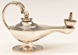 Egyptian silver novelty tabletop lighter formed as an ancient oil lamp, length 12cm, weight 95g