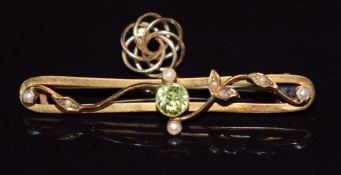 Edwardian 9ct gold brooch set with a peridot and seed pearls and a gold earring, 2.8g