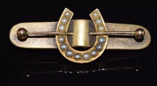 Victorian yellow metal brooch in the form of a horseshoe set with split pearls, 4.9g, 4.7cm
