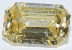 A loose 0.38ct natural fancy yellow emerald cut diamond, with IGL certificate