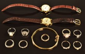 Nine silver rings, watches and rolled gold bangle