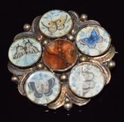 Victorian brooch set with moss agate and five painted butterflies in separate sections, 4cm