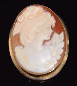 A 9ct gold pendant/ brooch set with a cameo depicting a young woman, signed to verso, 3.3 x 4cm