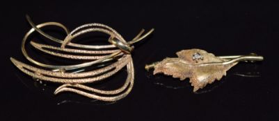 A 14k gold leaf brooch set with a diamond (3.2g) and another 9ct gold brooch, 3.3g