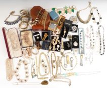 A collection of costume jewellery including silver and other necklaces, diamanté, faux pearls,
