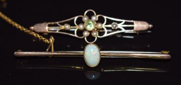 A 9ct gold brooch set with an opal cabochon and an Edwardian 9ct gold brooch set with peridot and