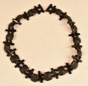 Victorian jet necklace made up of faceted and carved cameo beads
