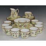 Approximately thirty seven pieces of late 19th/20thC porcelain tea ware decorated with blossom