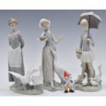 Three Lladro figures and a Wade Big Ears, tallest 27cm