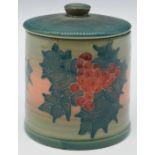 Dennis Chinaworks signed circular covered box decorated with holly, script to base 'Trial 40' and