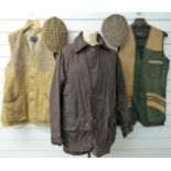 A collection of shooting clothing comprising two Top Gun shooting waistcoats size M, a John