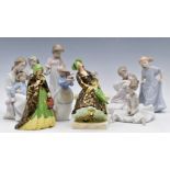 Nine boxed Nao figures and two Tuscan China figurines, April Showers and Lady of the Lamp, both '