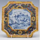 Delft 18th/19thC Dutch shaped plaque with pastoral scene and polychrome decorated surround, 22.5 x