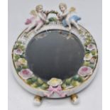 Volkstedt wall mirror with applied figural putti / flower decoration, H27cm