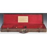 Leather and canvas bound shotgun case with fitted interior and 'Under Royal Patronage Edwinson Green
