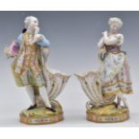 A pair of 19thC continental Vion and Baury figural cornucopia cache/spill holders with script to